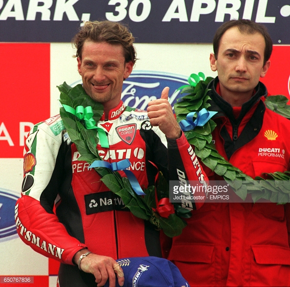 carl-fogarty-gives-a-thumbs-up-to-the-crowd-after-winning-the-first-picture-id650767836.jpg