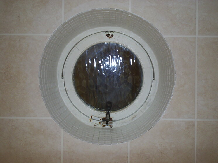 Julie Flynn - St Margarets tiled bathroom porthole window with 1x1 mosaics and 12x10 porcelain t.JPG