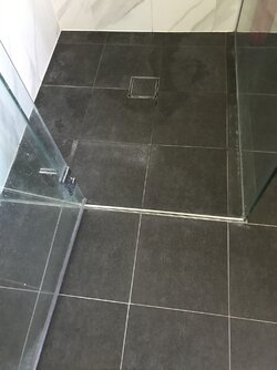 Removing white marks from black bathroom tiles | Tilers Forums