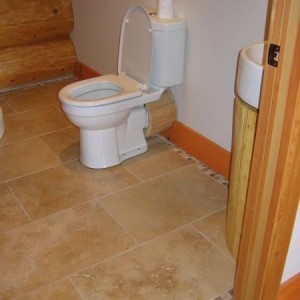 Travertine floor and border in a Log House