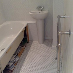 Teddington - tiled bathrooom walls and floor using 1x1 octogan mosaic tiles