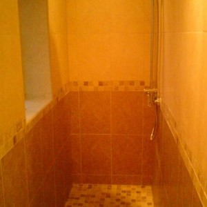Walk in shower with ceramic and stone