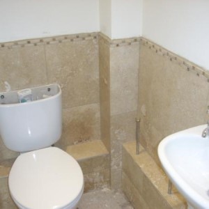 WC USING TRAVERTINE TILES AND BORDER