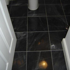 Marble floor, had to cut around sanitary fittings due to plumbing constrants, new build.