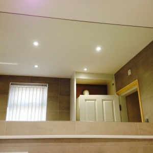 Big  mirror over silestone work top