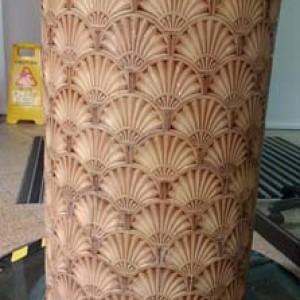 Column with embossed Victorian tiling follow restoration.