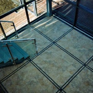 COMMERCIAL RECEPTION - 'STONE EFFECT' TILE WITH POLISHED PORCELAIN INLAYS.