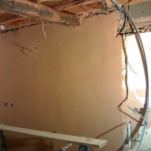 celing lifted, beams put in walls plastered