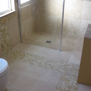 May 2009 Sandstone pebble mosaic = real pain to grout!