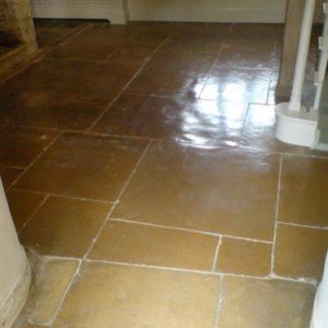 300 year old limestone.  Cleaned, regrouted and sealed with a linseed based impregnating sealant.  Then burnished with a high speed polisher.