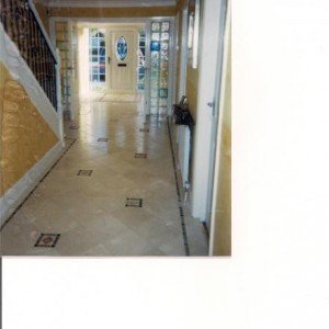 2) ENTRANCE HALLWAY - OUT- 300X300 MM CREMA MARFIL MARBLE WITH TUMBLED MARBLE INLAY BORDER AND TACO INSETS.