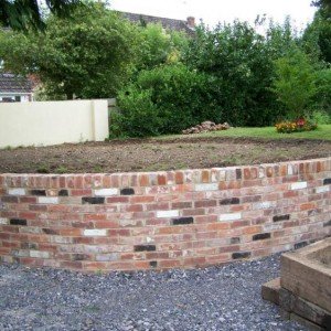 garden 3 - retaining brick wall at bottom of garden