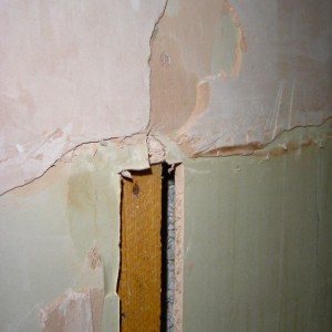 detail of east wall at  bath head showing  bare plasterboard and stud