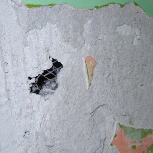 east wall detail showing metal lath exposed under lime plaster