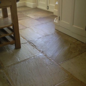 Indian Sandstone floor.  Cleaned for years with Flash / Daz/ Bleach left this floor getting dirtier and dirtier.  The sealant had been stripped by the careful cleaning using these products.  We degreased, deep cleaned and then sealed it using a strong surface sealant.