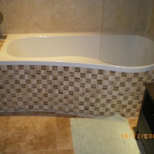 bath panel made up of marmox board, then stone mosaics fitted,grouted and siliconed