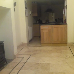 Travertine - 600x400mm Filled/Honed with Gulfstone 15mm inlay border & fire surround. Breakfast room to kitchen.