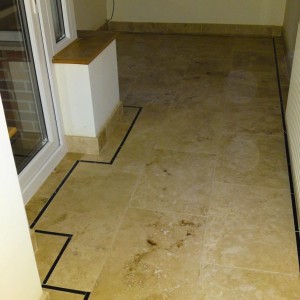 Travertine - 600x400mm Filled/Honed with Gulfstone 15mm inlay border. Breakfast room to conservatory