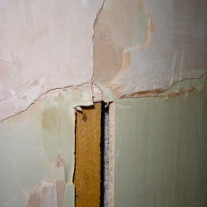 detail of east wall at  bath head showing  bare plasterboard and stud