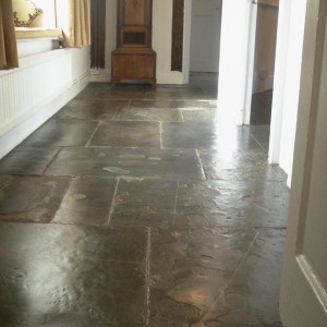 300 year old Limestone flags.  These were shalling and breaking up.  we had to stabilise them, clean them and stop one or two from rocking.   These go into 3 other rooms.  The owners wanted traditional methods used, so we oiled them (linseed/stone oil) twice to create a strong mechanical finish and then  beeswaxed them twice.  Lots and lots of hands and knees work!! We loved this job!