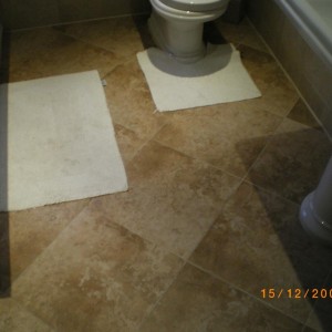 400x400 ceramic tiles. The whole floor tiled before any fittings were installed.