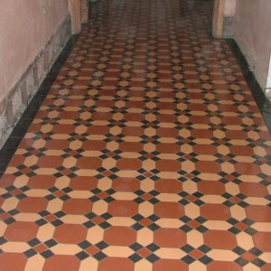 bwden newsection This section was new in a long corridor lifted the original tiles for use to restore original sections.
These were cut from 6x6 the original were 6.5 inches sq. so would have needed a new mould making to produce same size. Conservation officer let us use new as long as they looked good enough to match in as the building was listed.