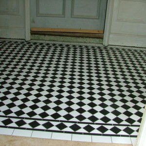 Ceramic B&W  Lifted an original badly damaged Victorian floor, client didn't want to pay to restore also was a bit tight so cut this replica floor from 300x300mm B&W tiles from topps took a day cutting it down but i think it looks the part ?