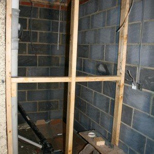 Partition wall seperating wetroom from kitchen.
Left side wall to be knocked through to create walk in area from bathroom.