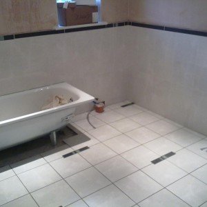 pain in the butt bathroom with ufh...borders cut from 600x300 slate with glass insets in walls/floor..the customer is always right!