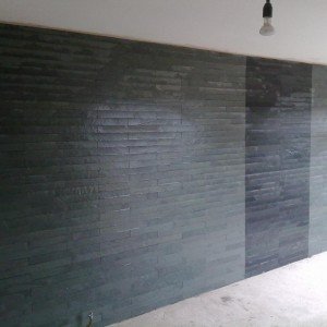 feature wall in artists lounge...600x10 green/grey and black brazillian slate, ungrouted.