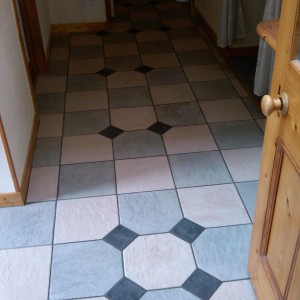 B&B in Stromness.
The pattern and setting out doesn't work as I was tied to following the bond through off a small porch the customer had done himself years ago....Customer chose where she wanted the black dots.

These were a full bodied porcelain by Keope and were without doubt the hardest tile I've ever come across!!