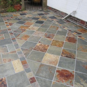 The Patio, my first attempt at natural stone, 18 Sq metre's using 300 x 300 natural riven slate from Wickes, cut to form central pattern. BAL adhesive & Groat. Total cost around £600, labour free....lol.....