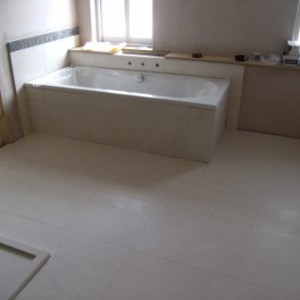 Floor tiled in honed limestone