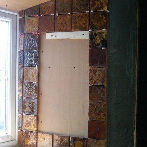 Hand made tiles were used as a frame for inset mirrors.