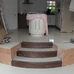 Raised kitchen area, curved steps down to extension thru to utility area
50 sq mtr Floor
B&Q 60x60
Polished Porcelain