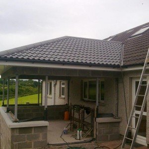 New sun room extension with head installed. Note state of old roof tiles.