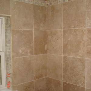 F&H Travertine  with a tumbled scabos mosaic border