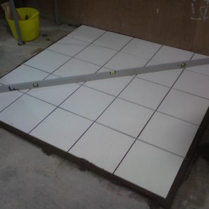 Tiling onto screed