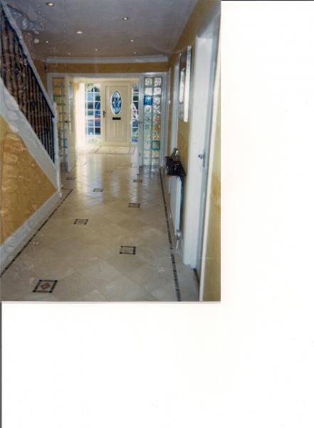 2) ENTRANCE HALLWAY - OUT- 300X300 MM CREMA MARFIL MARBLE WITH TUMBLED MARBLE INLAY BORDER AND TACO INSETS.