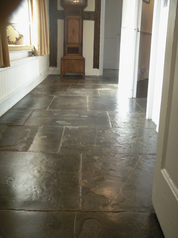 300 year old Limestone flags.  These were shalling and breaking up.  we had to stabilise them, clean them and stop one or two from rocking.   These go into 3 other rooms.  The owners wanted traditional methods used, so we oiled them (linseed/stone oil) twice to create a strong mechanical finish and then  beeswaxed them twice.  Lots and lots of hands and knees work!! We loved this job!