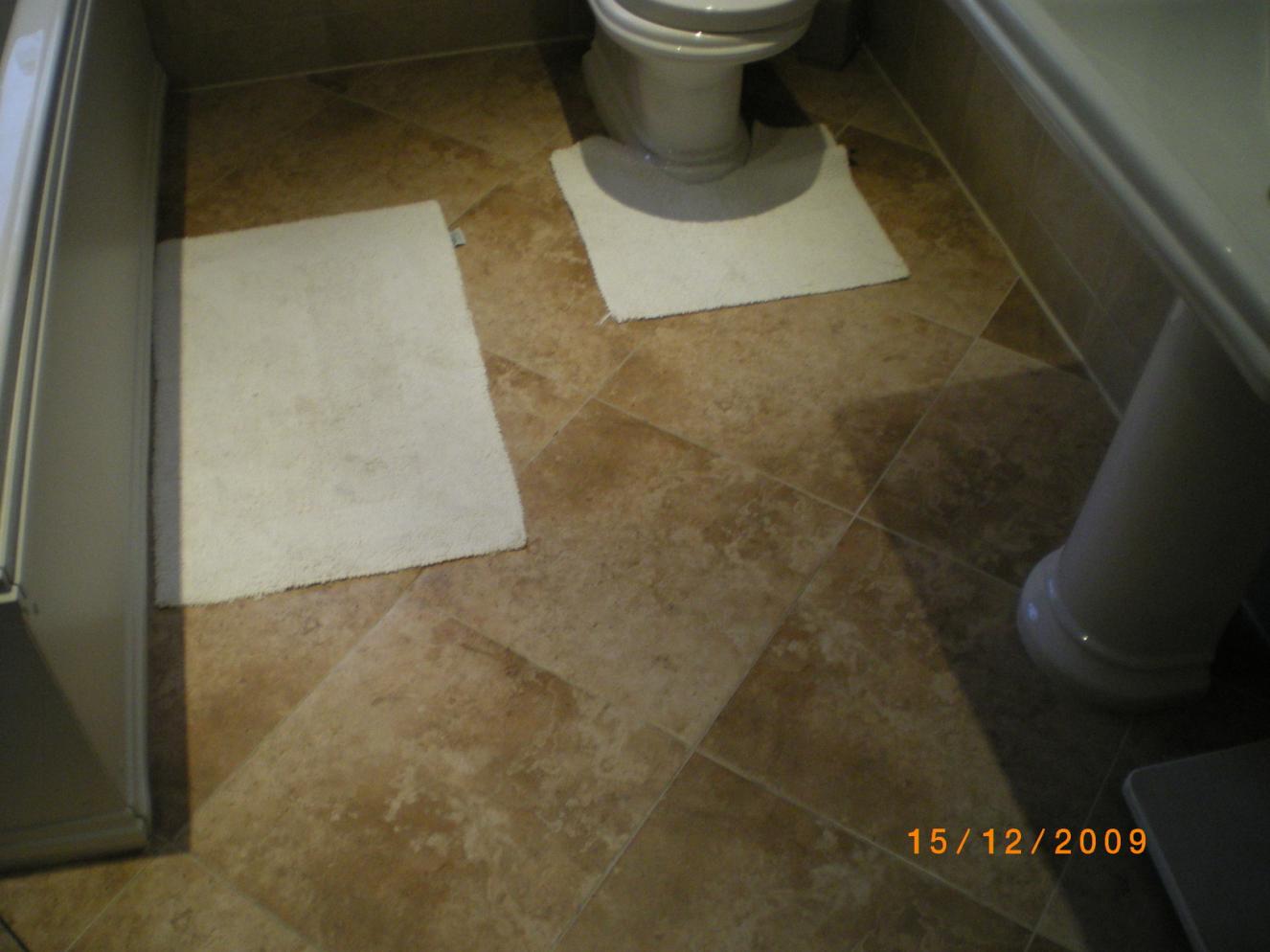 400x400 ceramic tiles. The whole floor tiled before any fittings were installed.