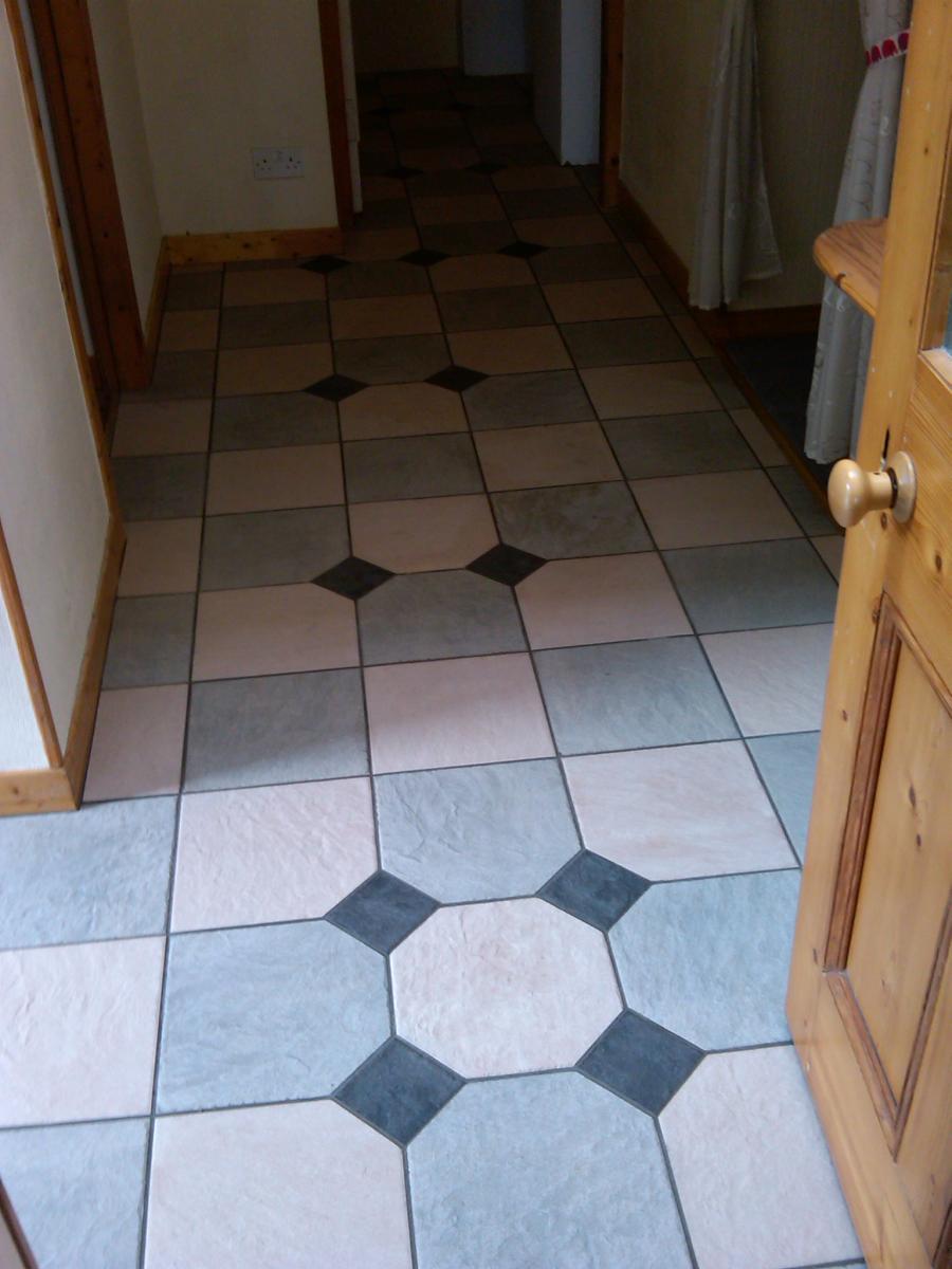 B&B in Stromness.
The pattern and setting out doesn't work as I was tied to following the bond through off a small porch the customer had done himself years ago....Customer chose where she wanted the black dots.

These were a full bodied porcelain by Keope and were without doubt the hardest tile I've ever come across!!