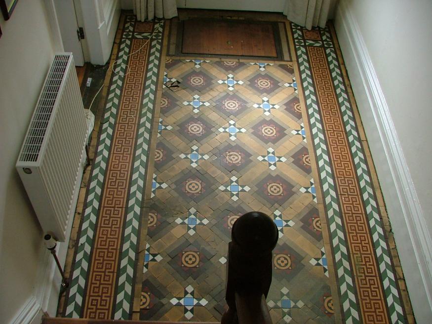 b4collingham this floor was covered in bitumen then had newspapers pressed into the tar it was really bad the client tried to remove above with gallons of white spirit.

The floor screed was shot so all the tiles bar the borders were removed and new tiles = all the buff were cut as they had absorbed too much tar to get clean again.