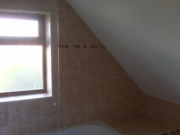 Bathroom tiling with sloping ceiling