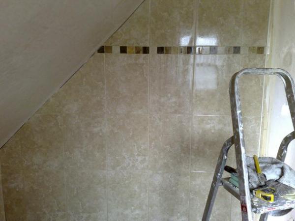 Bathroom tiling with sloping ceiling