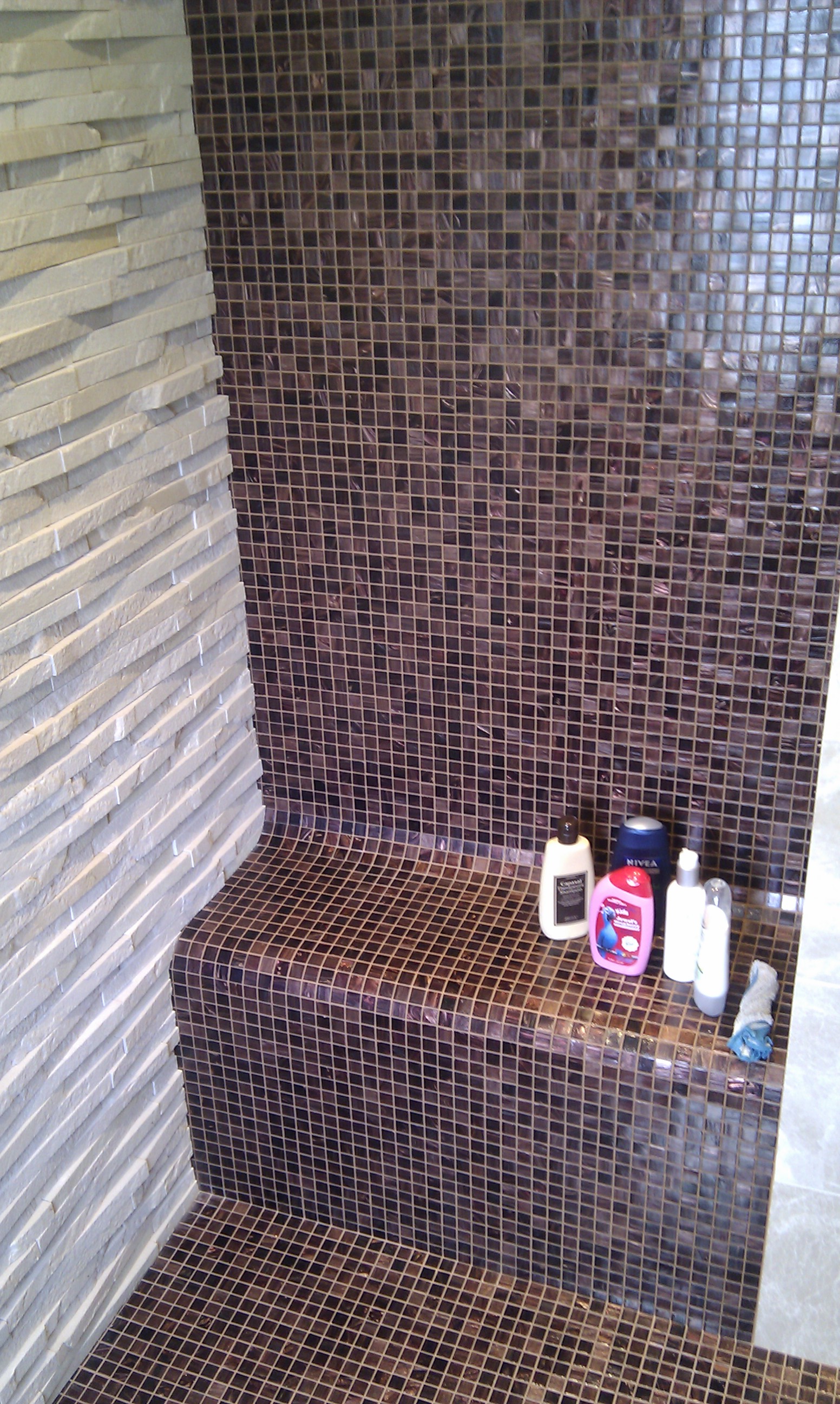 Bisazza and natural stone wetroom.