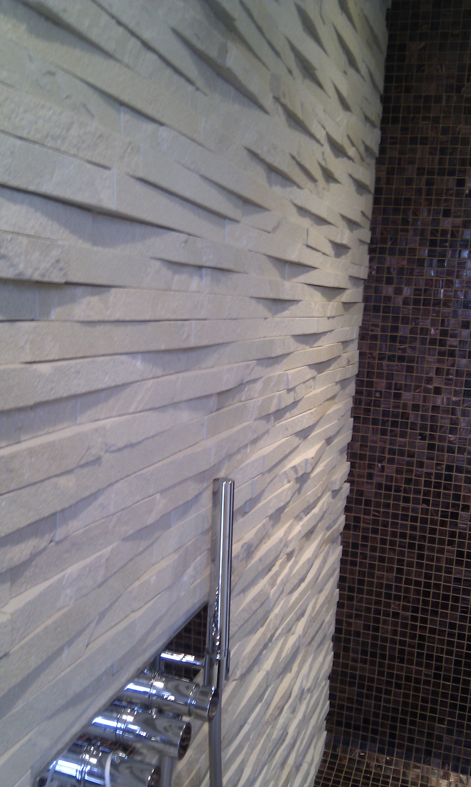 Bisazza and natural stone wetroom.