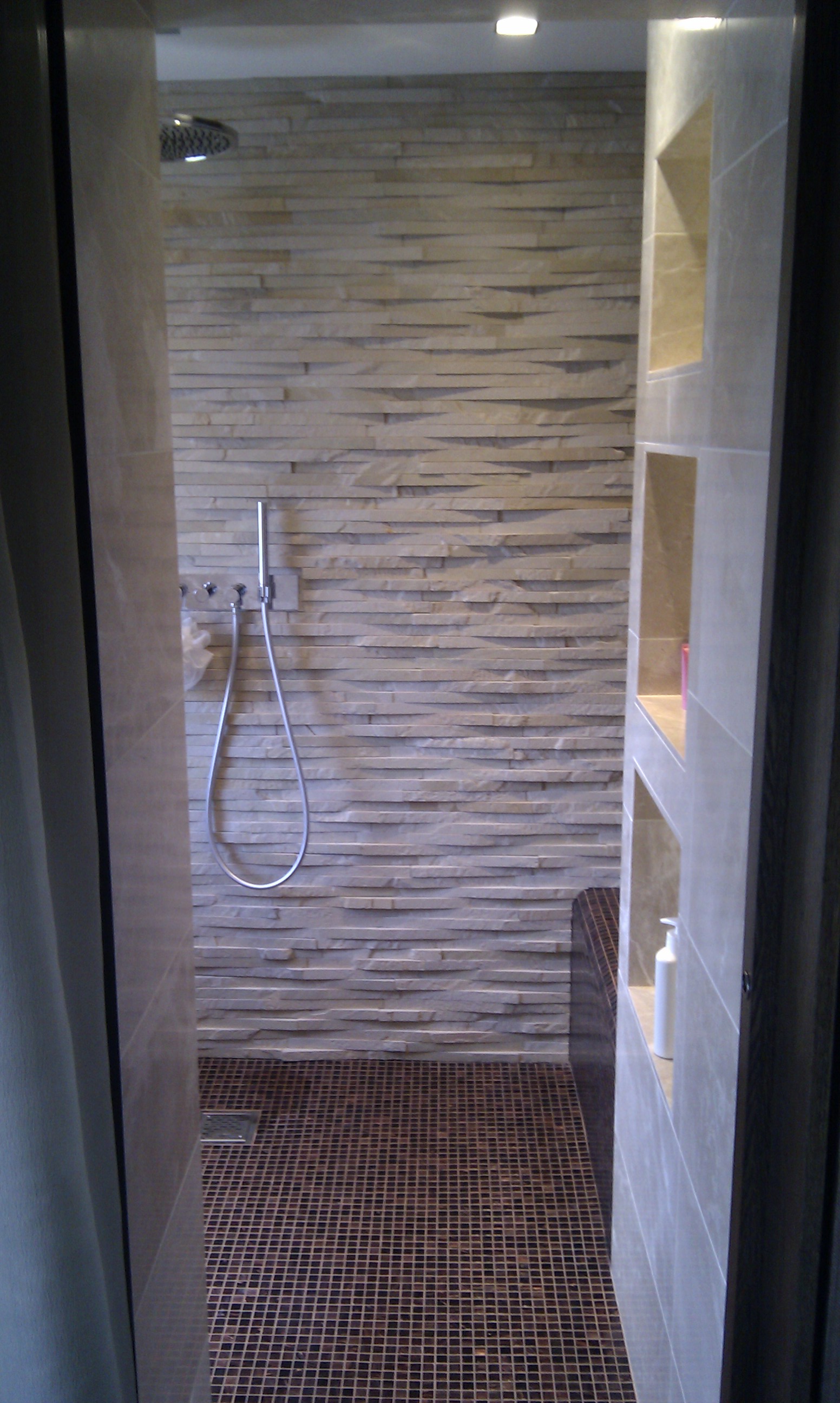 Bisazza and natural stone wetroom.