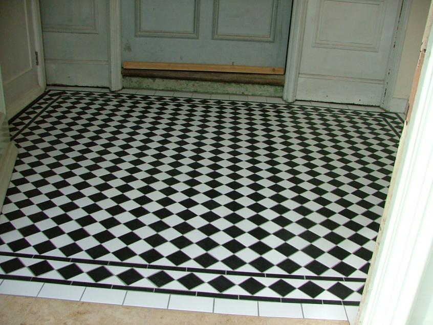 Ceramic B&W  Lifted an original badly damaged Victorian floor, client didn't want to pay to restore also was a bit tight so cut this replica floor from 300x300mm B&W tiles from topps took a day cutting it down but i think it looks the part ?