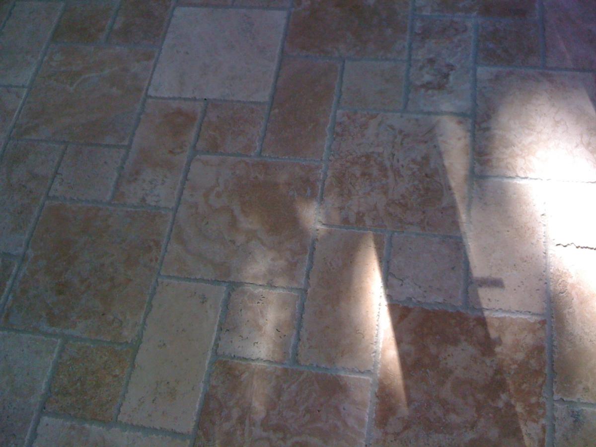 Chiselled edge travertine in the classic step pattern